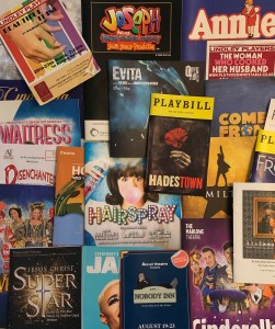 About 20 theatre programmes scattered atop each other.